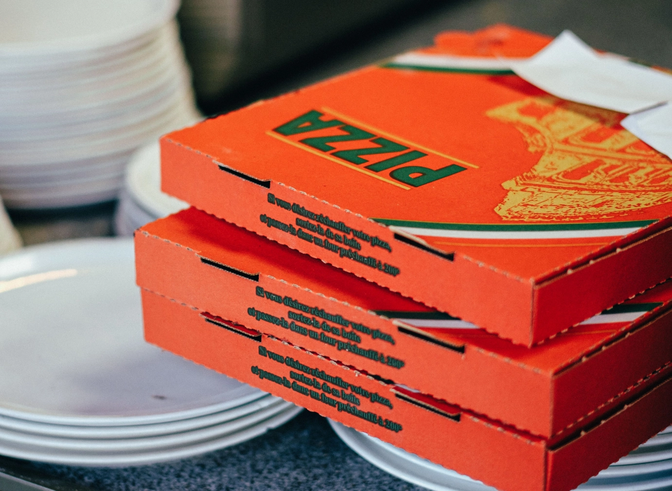a stack of pizza boxes